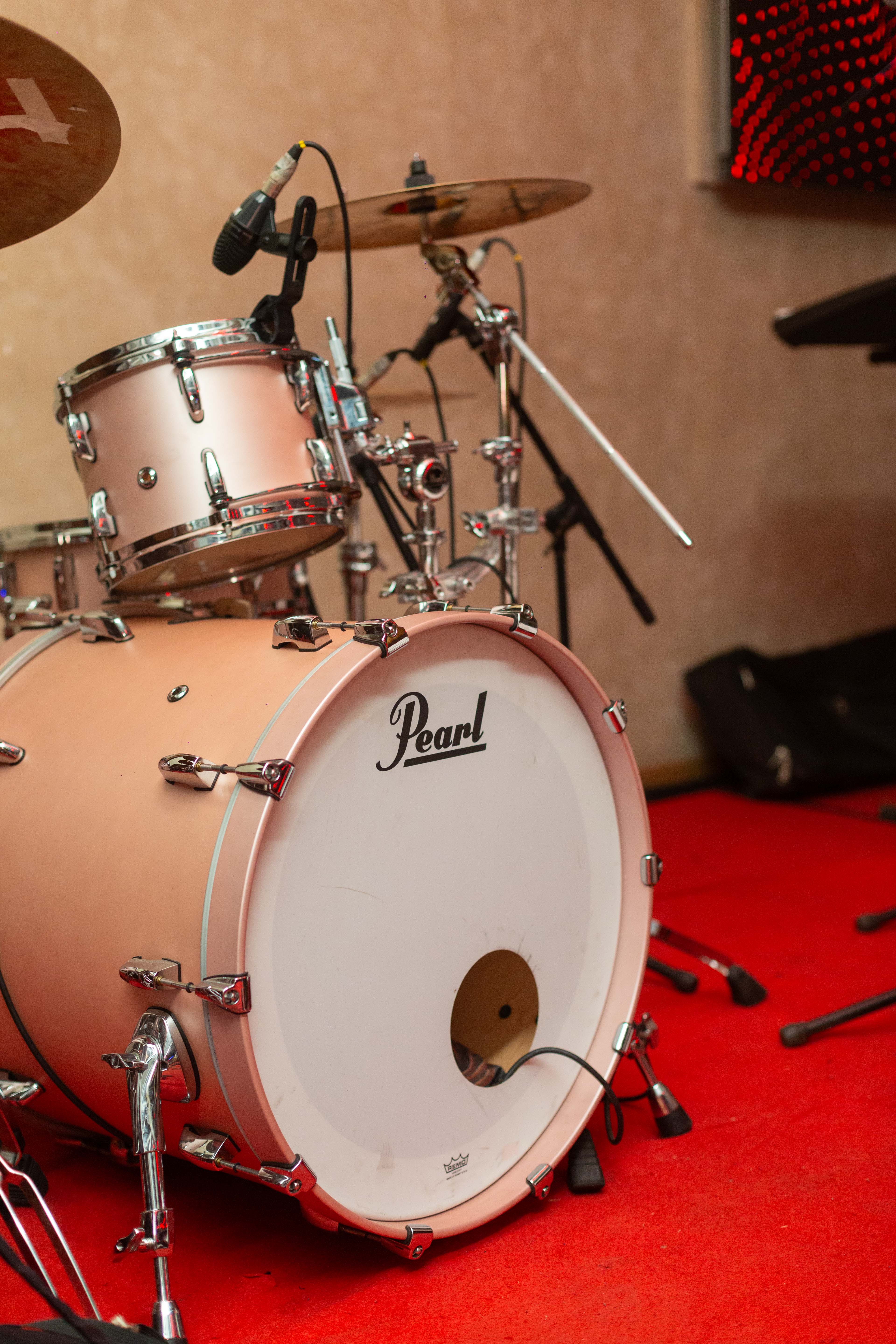 Close-up of a drum kit in a performance and recording environment.
